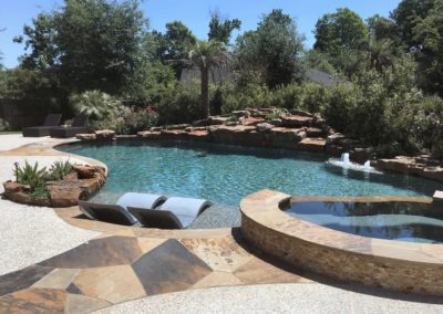 The Summer Ridge Project by All Star Pools - Tropical Paradise Lagoon Pool & Spa with Boulder Waterfall & Outdoor Kitchen