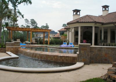Natural Swimming Pools Colona Project - Showcase Multilevel Vanishing Edge Pool with Spa and Outdoor Kitchen.